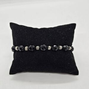 black and silver tone beaded bracelet with toggle clasp